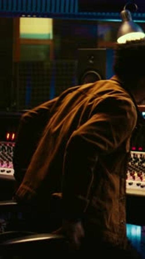 Vertical Video Tracking Engineer Working on a New Album and Recording Hit Song