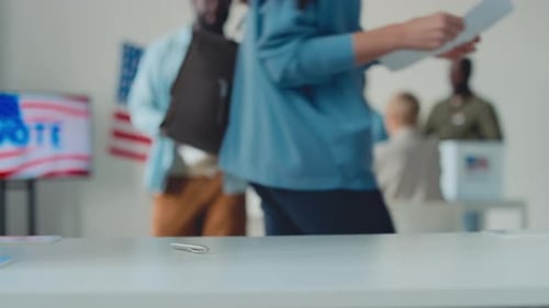 Multicultural American Citizens Voting in Booth at Electoral Precinct