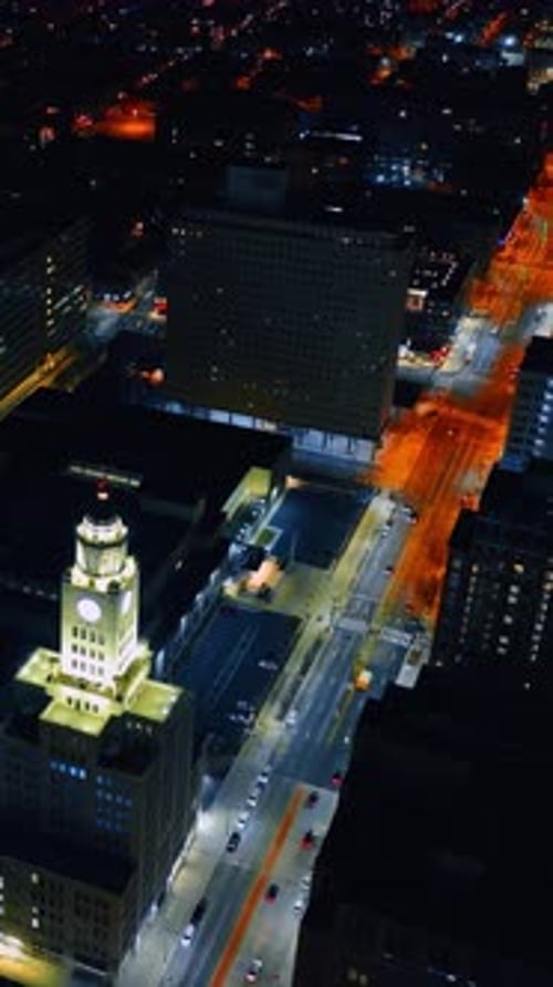 Broad highway along the City Hall well lit at night. Rising above the scenery of Philadelphia