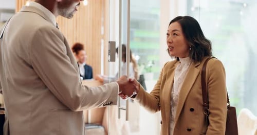 Partnership, meeting and business people with handshake in office for agreement, deal or contract