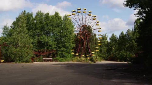 Pripyat Ferris wheel in abandoned amusement park, distance zoom out view
