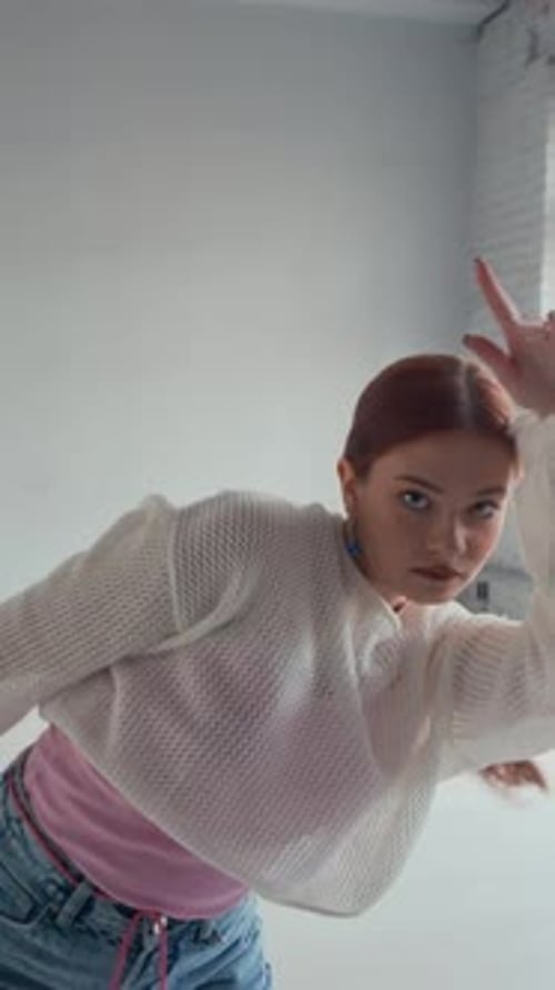 Girl Practicing Contemporary Dance Moves on Camera indoors, Vertical