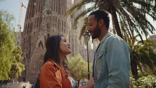 Young multiethnic couple visiting and dating in the center of Barcelona