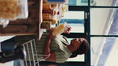 Woman Shops at Grocery Store for Food Jars