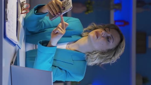 Vertical video of Home office worker woman having problems and stress on the phone.