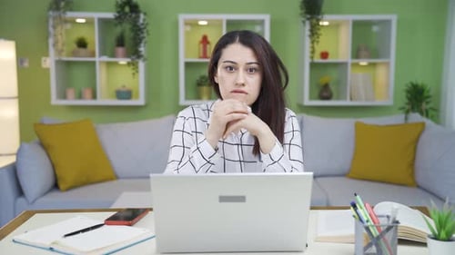 Shocked Woman at Laptop at Home