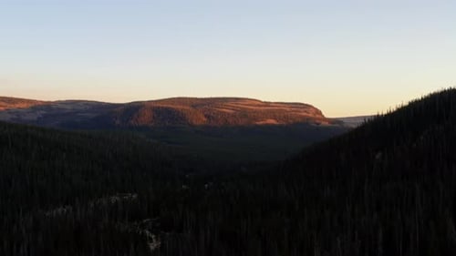 Dolly out landscape aerial shot of a canyon in the Uinta Wasatch Cache National Forest in Utah with