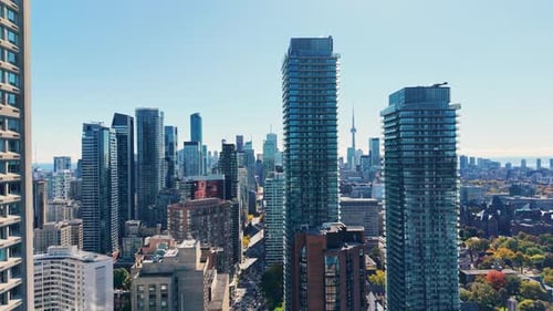Spectacular panoramic drone view of modern Downtown skyscrapers, CN Tower and Lake Ontario