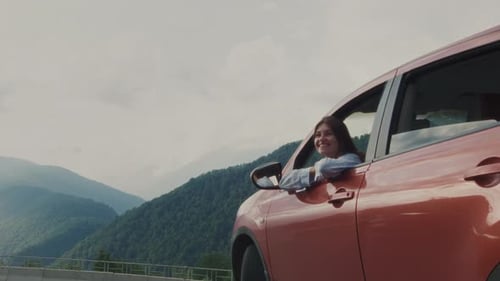 Pretty Girl Looks Out the Open Car Window Woman Sitting in Car with Window Open Female's Road Trip