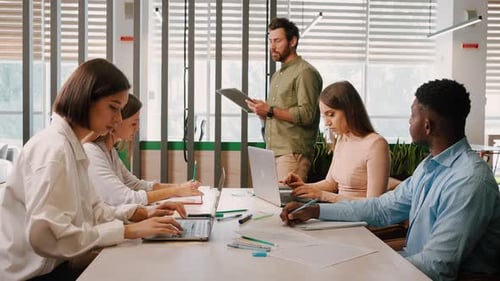 Team Meeting in Modern Collaborative Office Space
