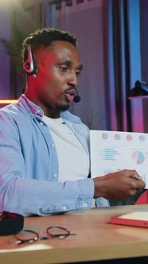 Man Explains Business Charts During Online Meeting