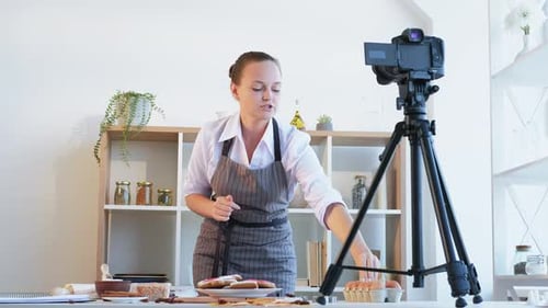 Woman Baking and Filming a Cooking Tutorial