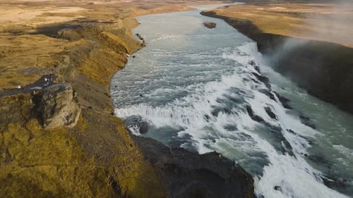 Aerial shot of a waterfall in an Icelandic river