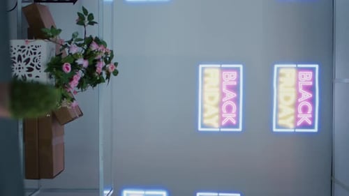 Flat Lay of Black Friday Neon Sign with Decor