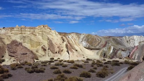 Scenic Desert Mountains Under Blue Sky Aerial View