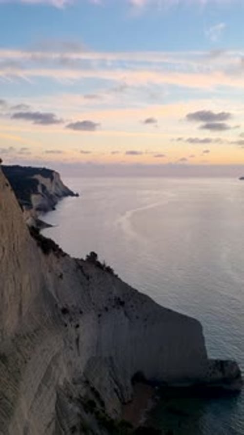 Vertical Aerial View of Dramatic White Cliffs at Cape Drastis and Loggas Beach in Northern Corfu