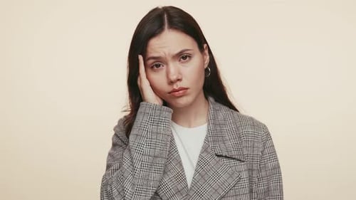 Young Woman with Headache Holding Side of Face