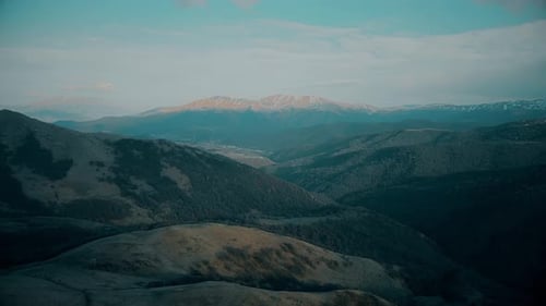 Scenic Aerial View of Rolling Tree-Covered Mountains