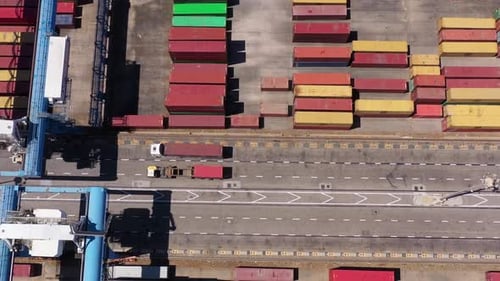 Truck with Container Driving in Harbor