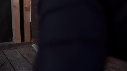 A Man is Kindling a Fire in a Wood Stove in Indre Fosen, Trondelag County, Norway - Close Up