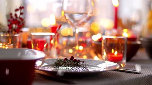 Festive Table Setting with Candles and Holiday Decorations