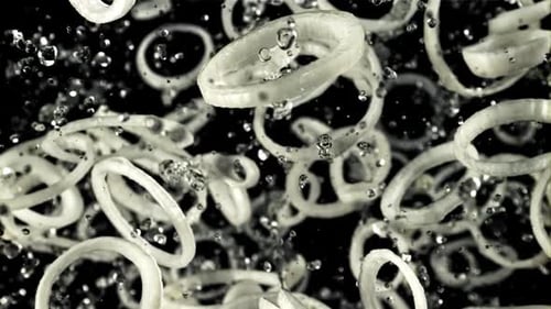 Sliced Onion Rings Falling in Slow Motion