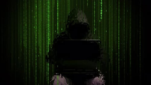 Cyber Hacker Working on Laptop with Green Binary Code Rain