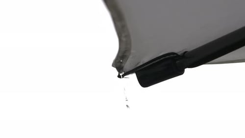 Water Droplets Falling from Gray Umbrella