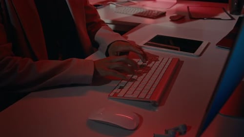 Woman Typing at Computer Displaying Critical Error