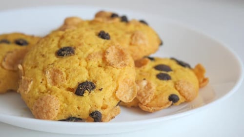 Golden Chocolate Chip Cookies on a White Plate