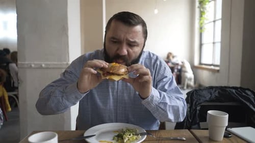 Hungry Man Eating Burger in Cafe 40s