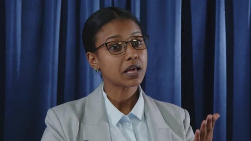 Woman Giving Speech at a Corporate Event