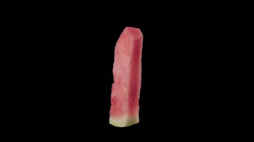 Delicious Slice of Watermelon Rotating on Black Background