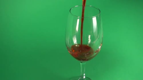 Dark Red Wine Being Poured into Wine Glass
