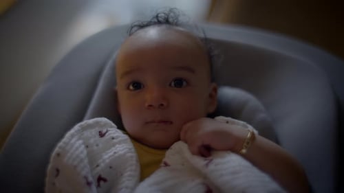 Sweet Infant Lying Calmly Indoors Close Up