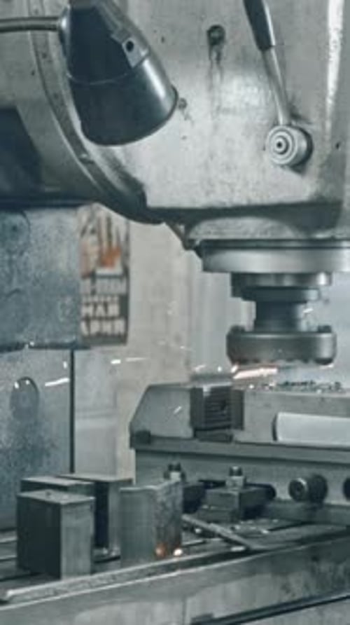 Metal Milling Machine Cutting Metal with Flying Sparks