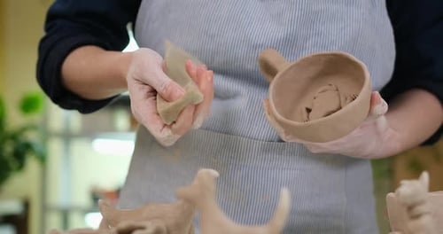 Woman Forming Clay Cup Shape By Hands Closeup in Artistic Studio
