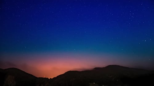 Starry Night Sky Above Dark Mountain Range