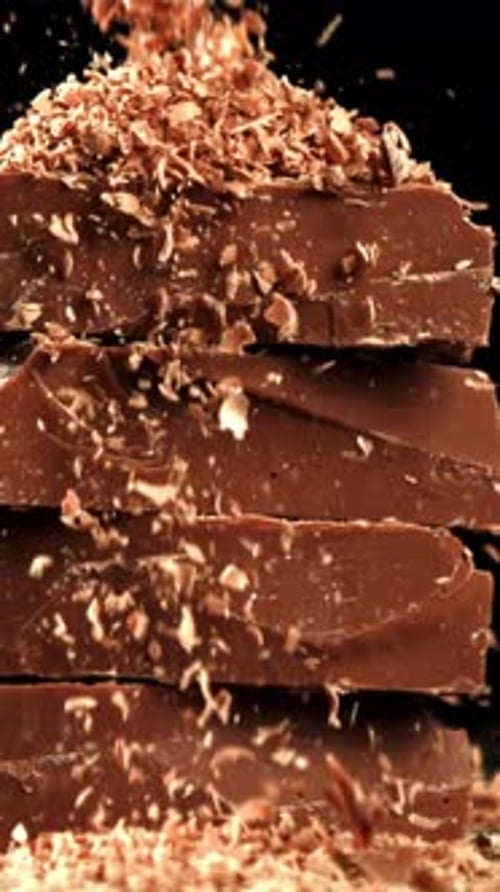 The Grated Chocolate Falls on the Chocolate Slices Filmed on a Highspeed Camera at 1000 Fps