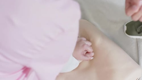 CPR Training on Mannequin in Hospital Setting