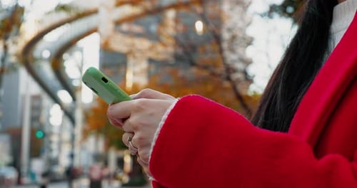 Woman, city and hands with phone for typing on social media, scroll notification