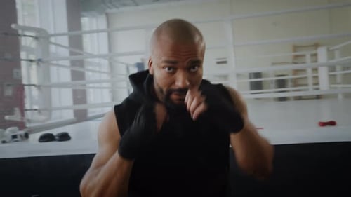 Strong Athlete Boxing in Boxing Ring