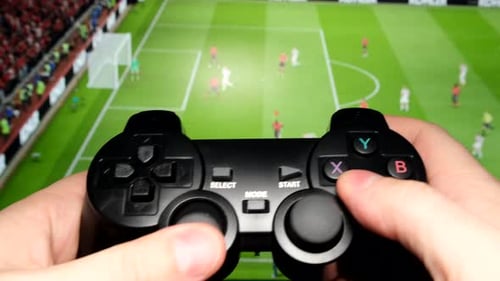 Computer Game of Football with the Help of a Console Close Up Vertical Video