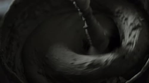 Cement Mixer Machine Mixing Cement in a Bucket