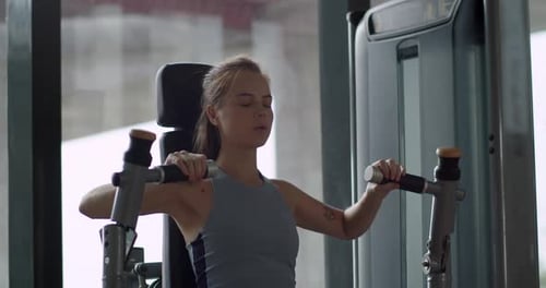 Sporty Young Woman Training Back Muscles in Gym Female Hands Taking Bodybuilding Dumbbells in Gym