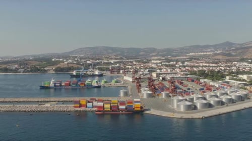 Aerial View of a Busy Port Filled with Shipping Containers Showcasing Various Shipping Operations