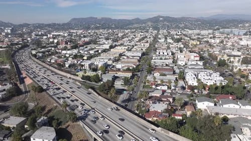 Congested Los Angeles freeway over East Hollywood neighborhood during the day