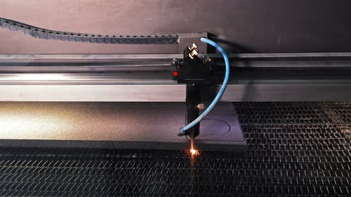 Laser Cutter Precisely Cuts Dark Material