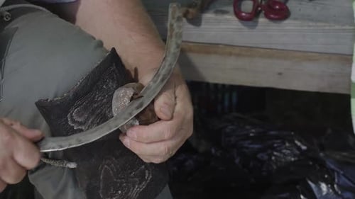 Man Carving Wood Outdoors Close Up