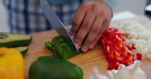 Cooking, healthy food and hands with knife in a kitchen with vegetables